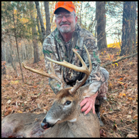 Hunter with prize buck