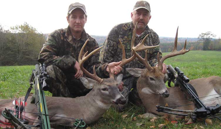 Hunters with deer